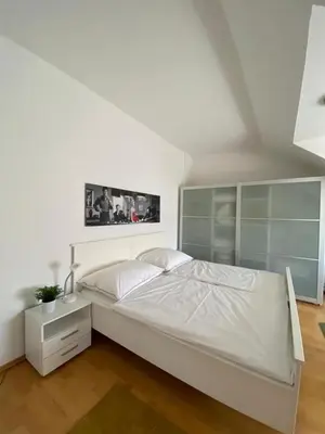 Ein Bett oder Betten in einem Zimmer der Unterkunft Cosy apartment in central location