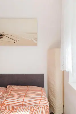 Ein Bett oder Betten in einem Zimmer der Unterkunft Cosy apartment near VIC (UNO City)