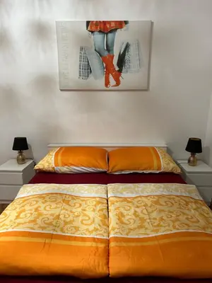Ein Bett oder Betten in einem Zimmer der Unterkunft Apartment opera 1