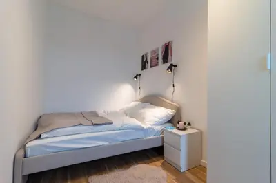 Ein Bett oder Betten in einem Zimmer der Unterkunft Central Apartment