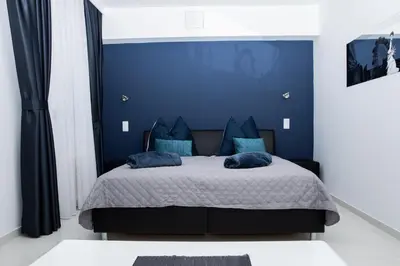 Ein Bett oder Betten in einem Zimmer der Unterkunft Vladys Vienna Apartments