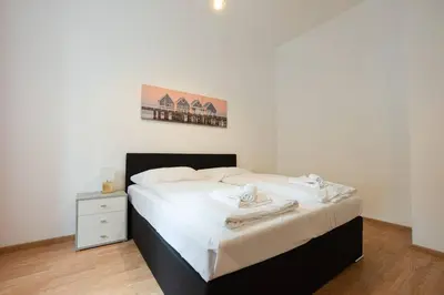 Ein Bett oder Betten in einem Zimmer der Unterkunft Apartment in the central area. 5 minute's walk to the Danube.