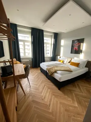 Ein Bett oder Betten in einem Zimmer der Unterkunft Boutique Hotel Kolbeck