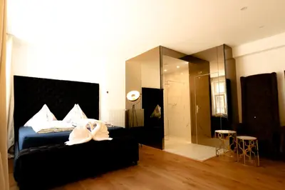 Ein Bett oder Betten in einem Zimmer der Unterkunft XuBa ApartmentRooms Messe Wien Prater