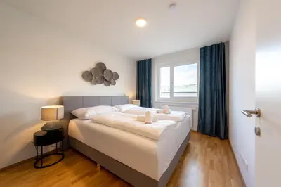 Ein Bett oder Betten in einem Zimmer der Unterkunft Modernes Stadtapartment mit Terrasse