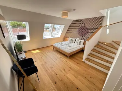 Ein Bett oder Betten in einem Zimmer der Unterkunft OrestaLiving - Penthouse in 2nd District with View