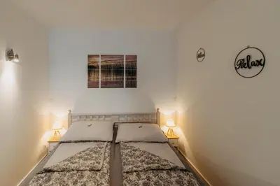 Ein Bett oder Betten in einem Zimmer der Unterkunft Ferienwohnungen Reiner - 5 Min zu Rust, Familypark & Seebühne, Burgenland Card inklusive
