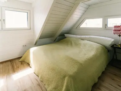 Ein Bett oder Betten in einem Zimmer der Unterkunft Seehütte Sonnenschilf - Premium Hide-Away Ferienhaus in Rust direkt am Neusiedlersee