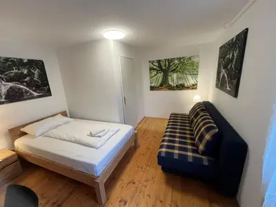 Ein Bett oder Betten in einem Zimmer der Unterkunft AJO Family House with free parking - Self-Check-in
