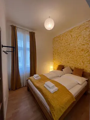 Ein Bett oder Betten in einem Zimmer der Unterkunft Spacious & Deluxe big apartment near Prater