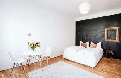 Ein Bett oder Betten in einem Zimmer der Unterkunft Cozy City Apartment