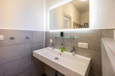 Ein Badezimmer in der Unterkunft Albizia-Apartments