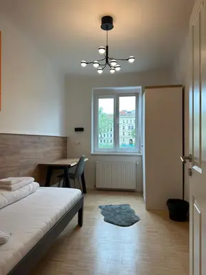 Ein Bett oder Betten in einem Zimmer der Unterkunft Lion`s Rooms n Apartments
