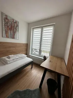Ein Bett oder Betten in einem Zimmer der Unterkunft Lion`s Rooms n Apartments