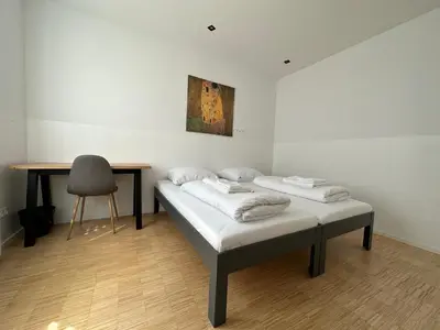 Ein Bett oder Betten in einem Zimmer der Unterkunft Lion`s Rooms n Apartments