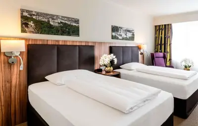 Ein Bett oder Betten in einem Zimmer der Unterkunft PLAZA Premium Wien
