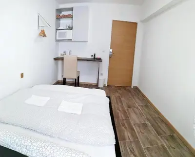Ein Bett oder Betten in einem Zimmer der Unterkunft Smart Mini Hotel