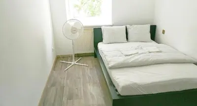 Ein Bett oder Betten in einem Zimmer der Unterkunft Smart Mini Hotel