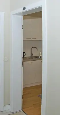 Küche/Küchenzeile in der Unterkunft White Lotus Apartment