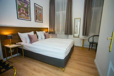 Ein Bett oder Betten in einem Zimmer der Unterkunft Pension Central I Self Check In