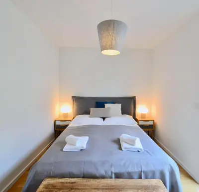 Ein Bett oder Betten in einem Zimmer der Unterkunft Cozy Design Apartment