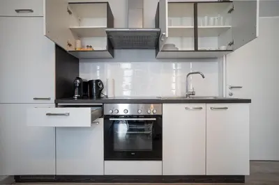 Küche/Küchenzeile in der Unterkunft Beautiful New Apartment near City Center
