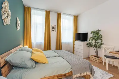 Ein Bett oder Betten in einem Zimmer der Unterkunft Beautiful Apartment - 12 minutes to City Center
