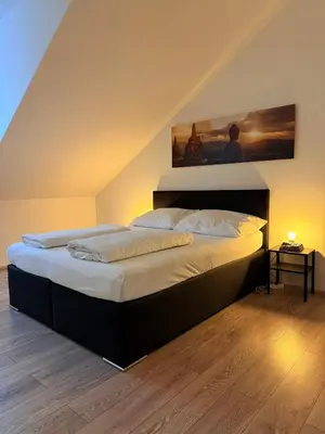 Ein Bett oder Betten in einem Zimmer der Unterkunft Dachterrasse für 4 Personen