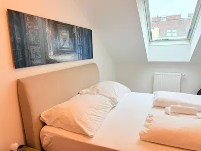 Ein Bett oder Betten in einem Zimmer der Unterkunft Dachterrasse für 4 Personen