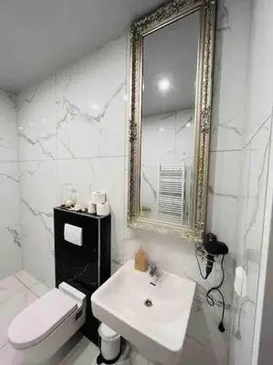 Ein Badezimmer in der Unterkunft XuBa ApartmentRooms I Wien Messe Prater I Küchenzeile