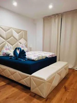 Ein Bett oder Betten in einem Zimmer der Unterkunft XuBa ApartmentRooms I Wien Messe Prater I Küchenzeile