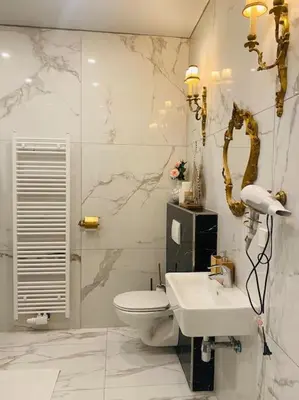 Ein Badezimmer in der Unterkunft XuBa ApartmentRooms I Wien Messe Prater I Küchenzeile
