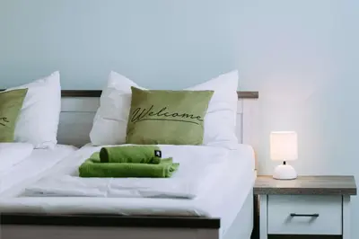 Ein Bett oder Betten in einem Zimmer der Unterkunft Weingut Guttmann - Apartment Schwalbennester