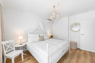 Ein Bett oder Betten in einem Zimmer der Unterkunft Landhaus Rust
