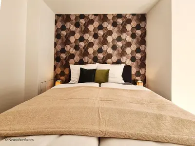 Ein Bett oder Betten in einem Zimmer der Unterkunft St Antoni Suite2 Stilvolle Ferienwohnung mit Parkplatz in Eisenstadt