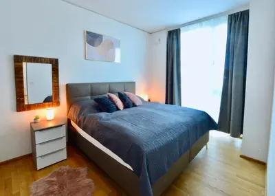 Ein Bett oder Betten in einem Zimmer der Unterkunft Skyscraper-Feeling With Parking Nearby