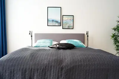 Ein Bett oder Betten in einem Zimmer der Unterkunft Trendy Apartment zentral gelegen
