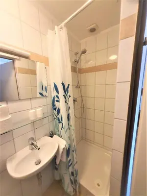 Ein Badezimmer in der Unterkunft Pension Schwartzwirt