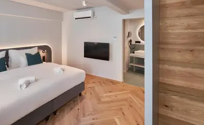 Ein Bett oder Betten in einem Zimmer der Unterkunft URBANAUTS STUDIOS Fillgrader
