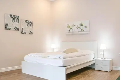 Ein Bett oder Betten in einem Zimmer der Unterkunft Stylish Apartment Wiener Stadthalle