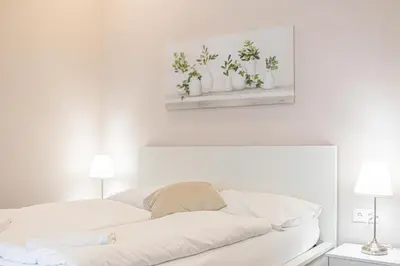Ein Bett oder Betten in einem Zimmer der Unterkunft Stylish Apartment Wiener Stadthalle