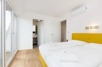 Ein Bett oder Betten in einem Zimmer der Unterkunft Central Riverside Residences