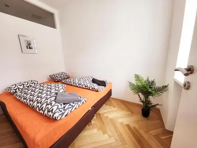 Ein Bett oder Betten in einem Zimmer der Unterkunft Donaufelder City Apartment