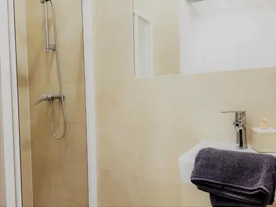 Ein Badezimmer in der Unterkunft Donaufelder City Apartment