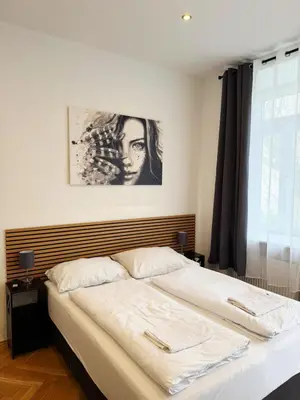 Ein Bett oder Betten in einem Zimmer der Unterkunft Donaufelder City Apartment