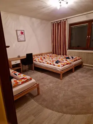 Ein Bett oder Betten in einem Zimmer der Unterkunft DrKarlRennerGarten