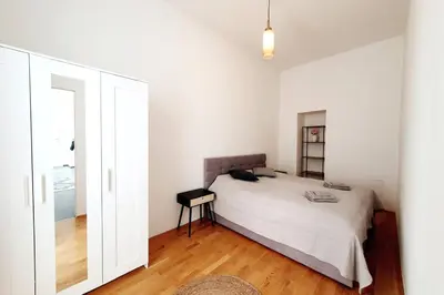 Ein Bett oder Betten in einem Zimmer der Unterkunft Savoir Vivre Apartments Rosinagasse